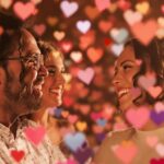 Two people connecting with colorful hearts around them.