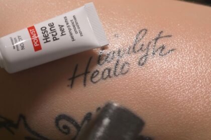 Fresh tattoo with healing ointment on skin surface.