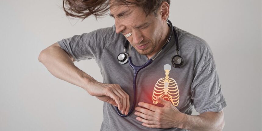 Person in pain holding left rib area.